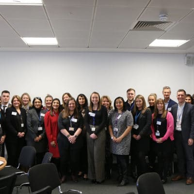 Group of event attendees stand together