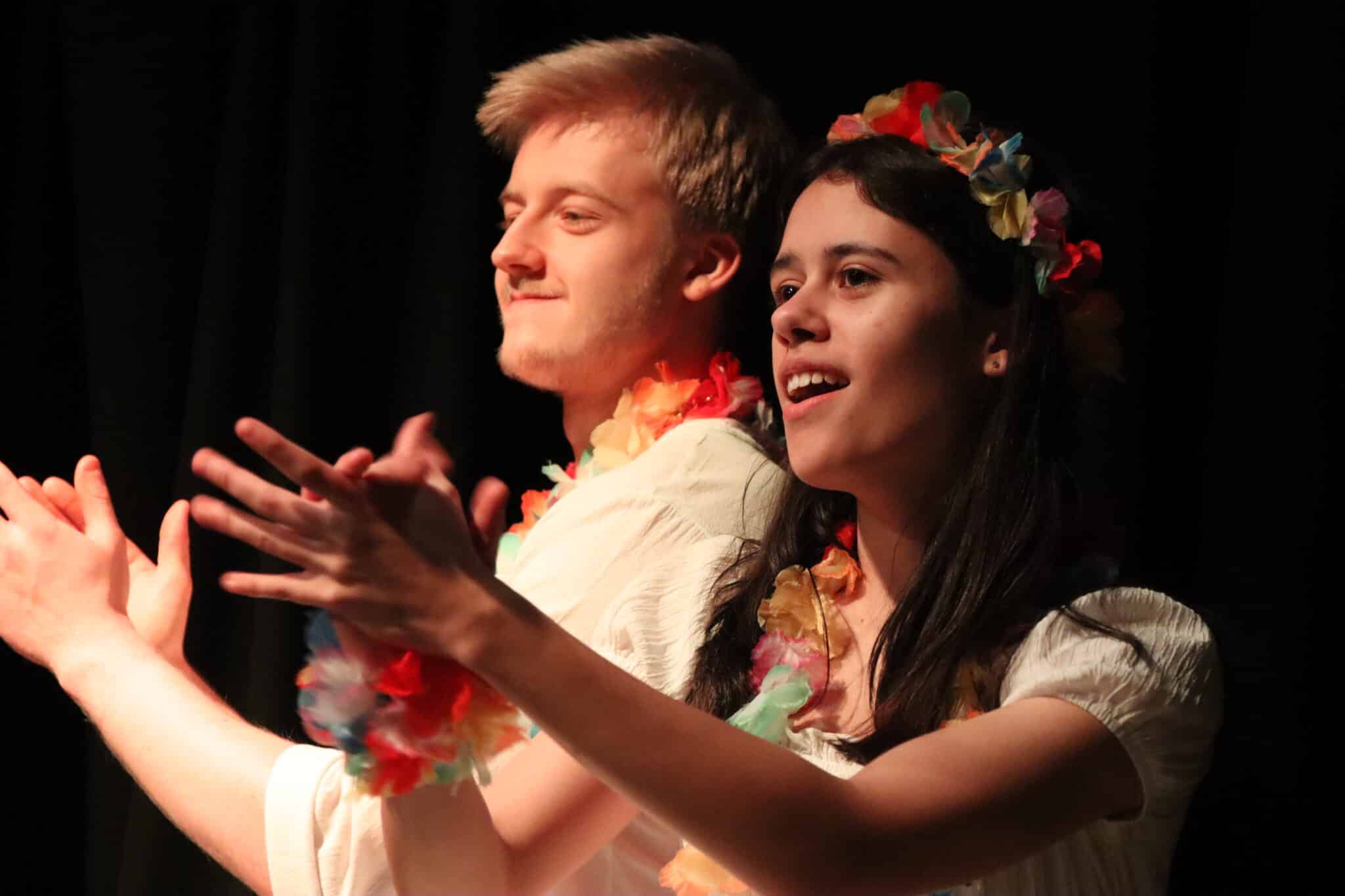 2 performers clapping