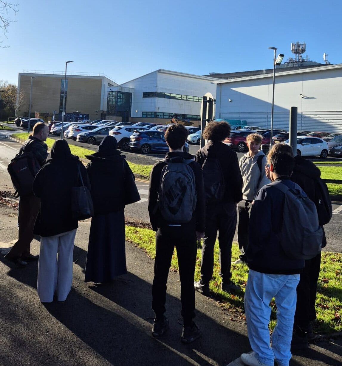 students outside checking out a mobile phone mast on top of Solihull College building